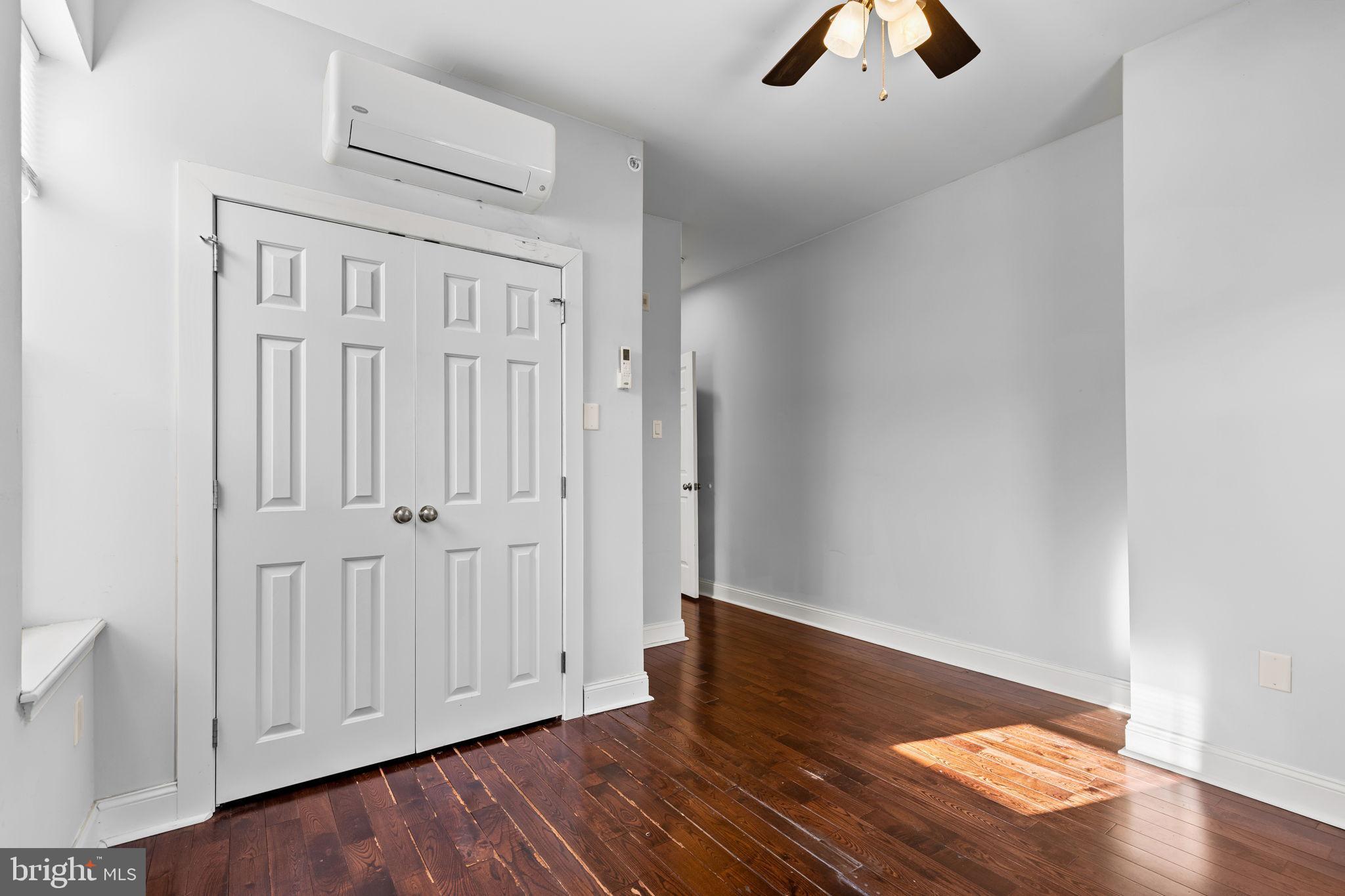 4633 Walnut Street, Unit D Philadelphia, PA 19139 - Photo 5 of 10 a view of an empty room with wooden floor