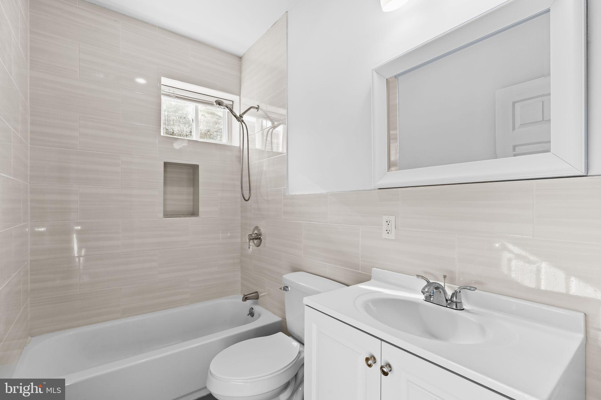 4633 Walnut Street, Unit D Philadelphia, PA 19139 - Photo 8 of 10 a bathroom with a sink toilet and bathtub