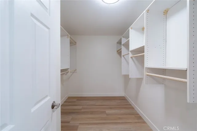 a view of entryway with stairs and wooden floor