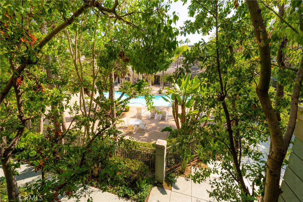 2233 Martin, Unit 202 Irvine, CA 92612 - Photo 20 of 33 a backyard of a house with lots of trees