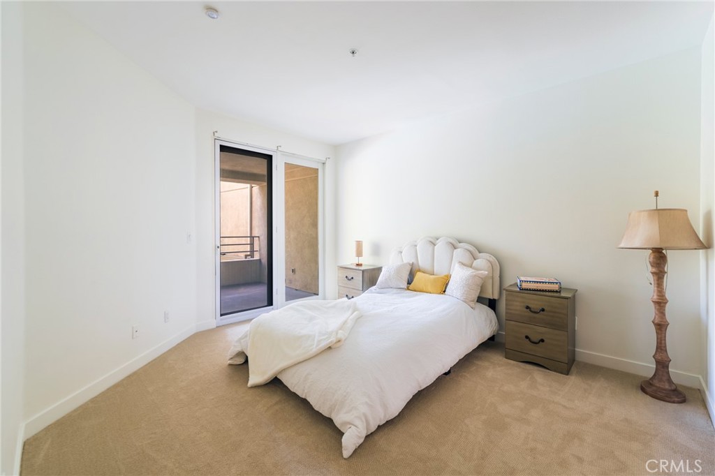2233 Martin, Unit 202 Irvine, CA 92612 - Photo 25 of 33 a bedroom with a bed and a window