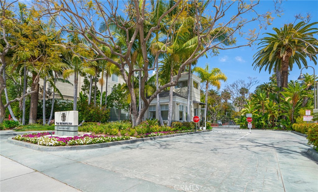 2233 Martin, Unit 202 Irvine, CA 92612 - Photo 28 of 33 a view of a pathway with a building and potted plants