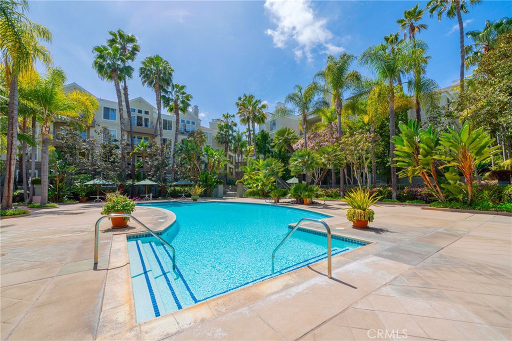 2233 Martin, Unit 202 Irvine, CA 92612 - Photo 31 of 33 a view of swimming pool with chairs