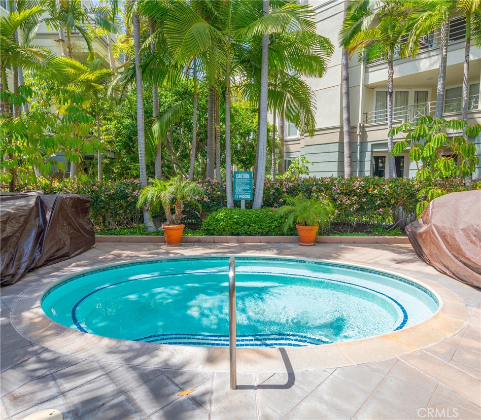 2233 Martin, Unit 202 Irvine, CA 92612 - Photo 32 of 33 a view of a swimming pool with a patio
