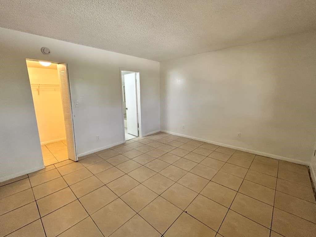 6900 Southwest 39th Street, Unit 305J Davie, FL 33314 - Photo 12 of 20 an empty room with a window