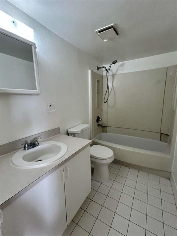 6900 Southwest 39th Street, Unit 305J Davie, FL 33314 - Photo 15 of 20 a bathroom with a sink a toilet and shower