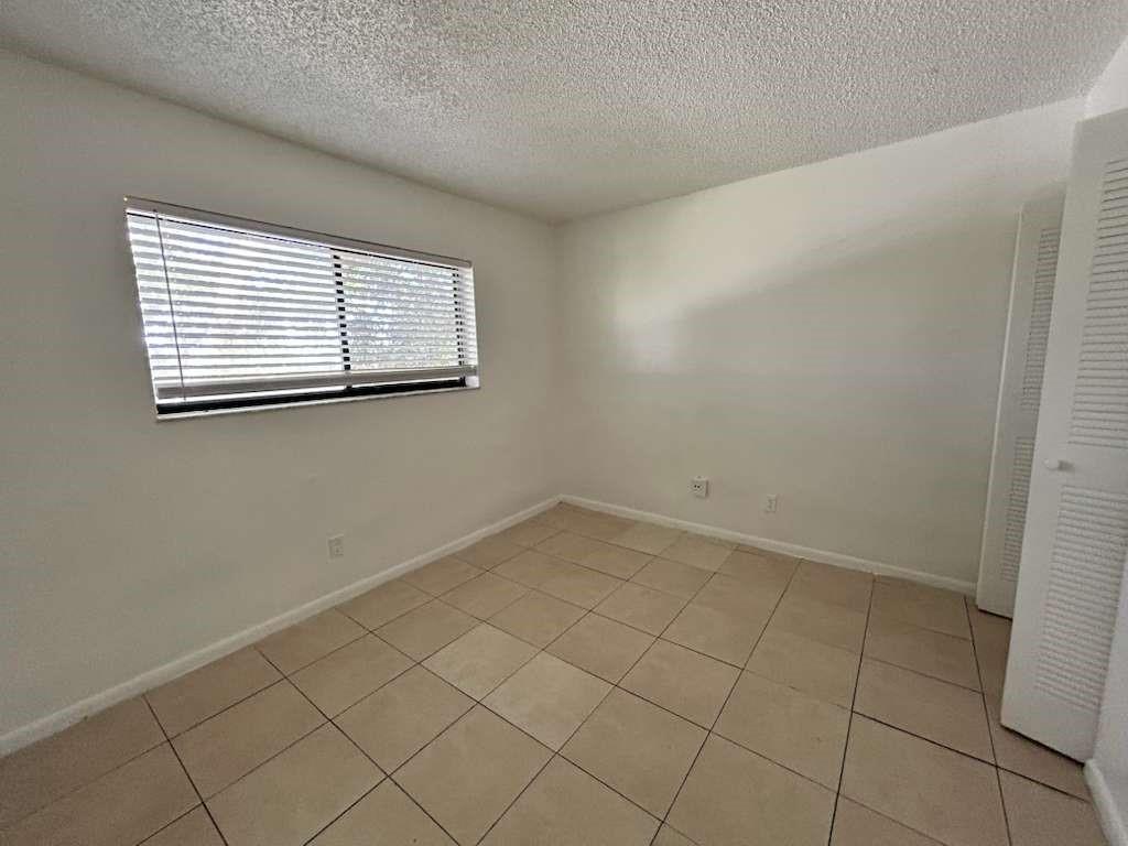 6900 Southwest 39th Street, Unit 305J Davie, FL 33314 - Photo 18 of 20 an empty room with a window