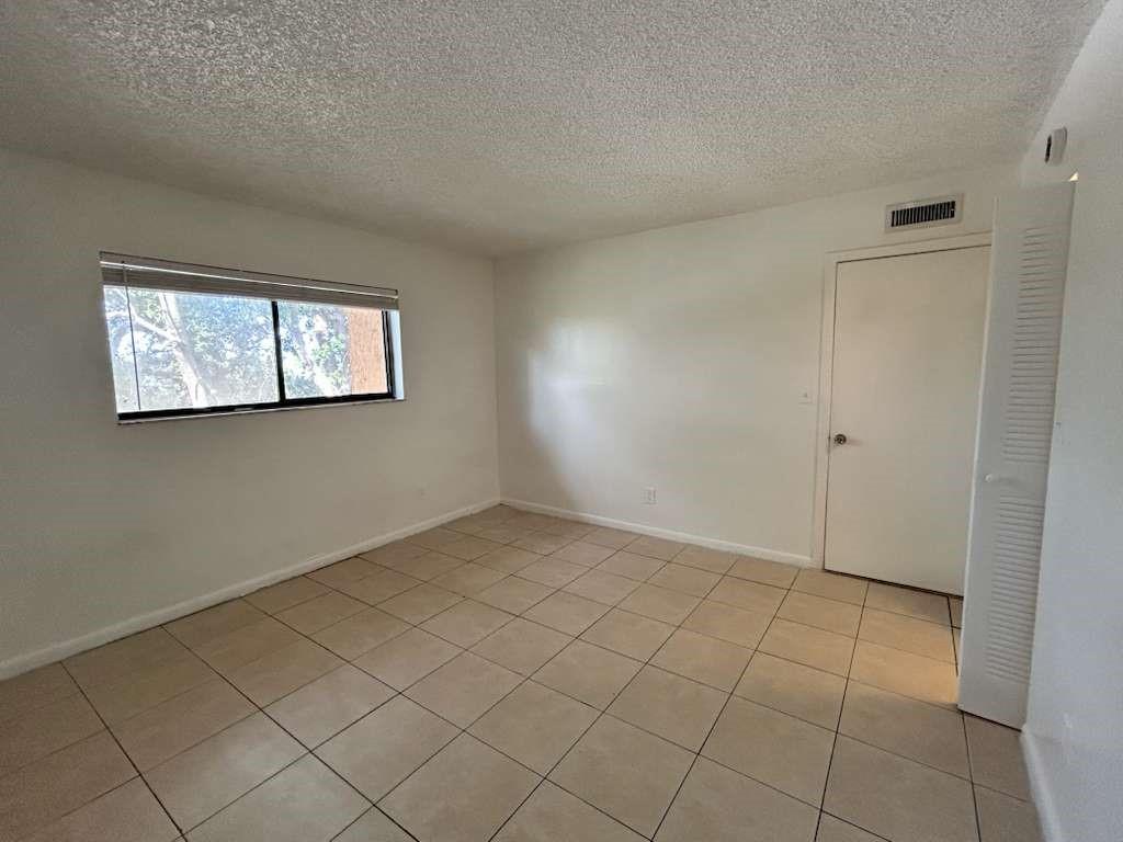 6900 Southwest 39th Street, Unit 305J Davie, FL 33314 - Photo 9 of 20 an empty room with windows