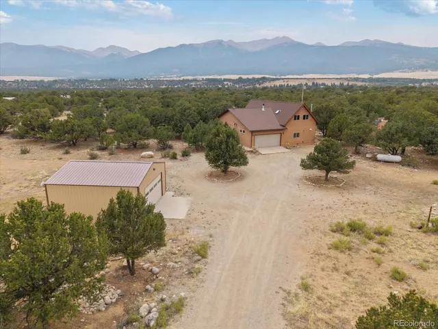 an aerial view of a house with mountain view