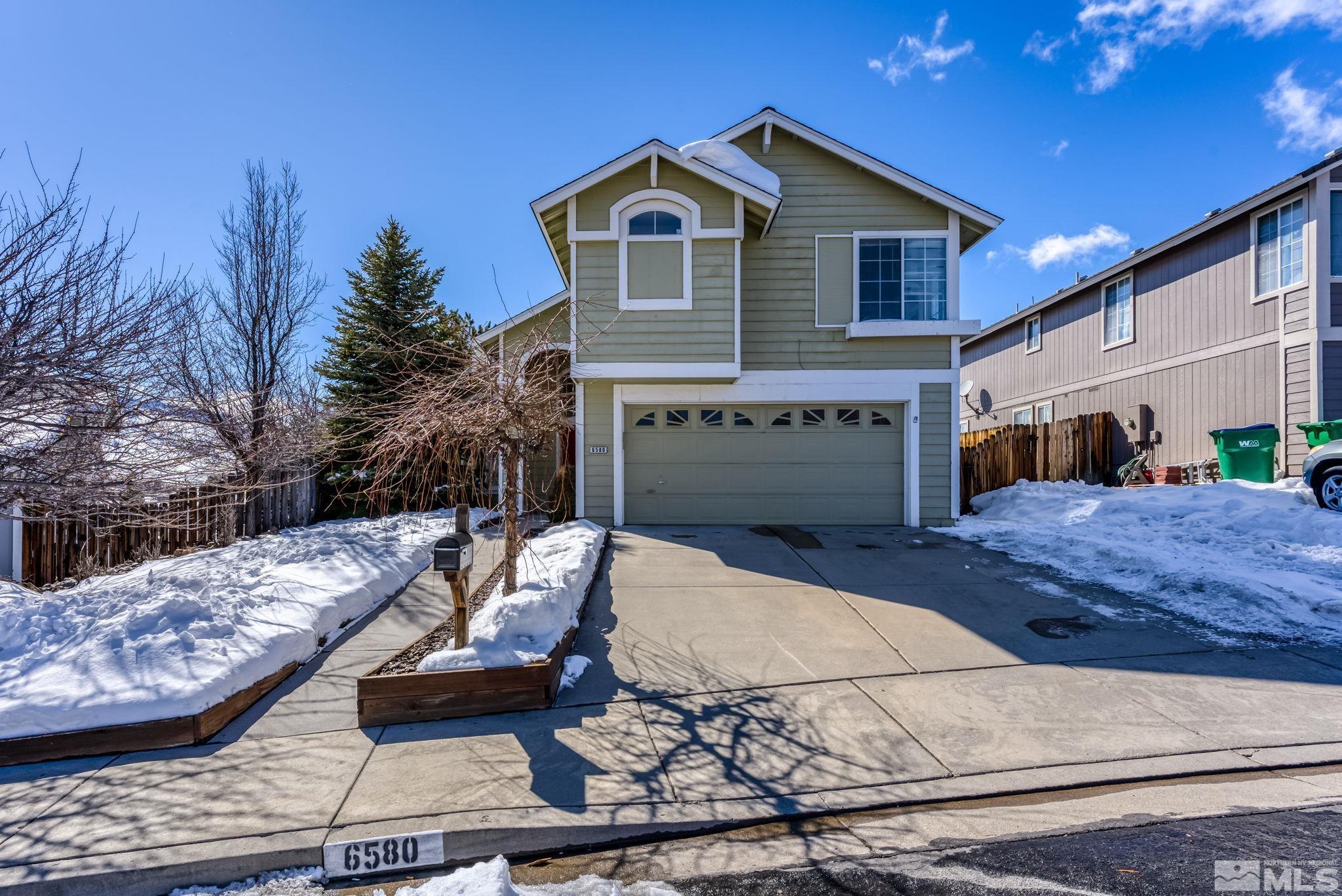 6580 Fall River Circle Reno, NV 89523 - Photo 1 of 36 a front view of a house with a yard