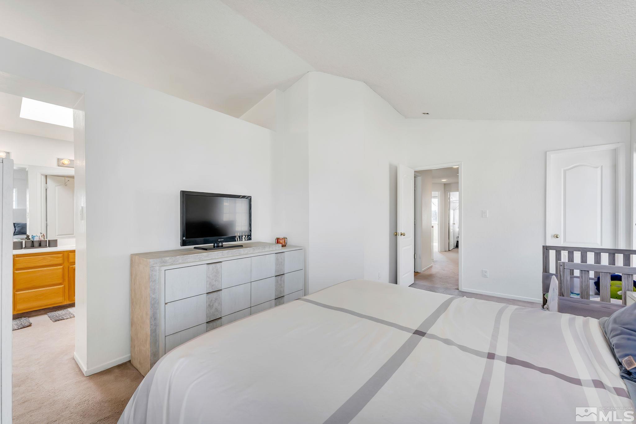 6580 Fall River Circle Reno, NV 89523 - Photo 26 of 36 a hotel room with a television and a bed
