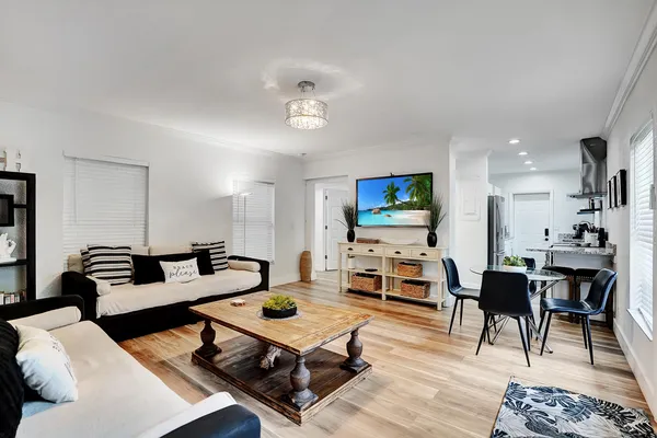 a bedroom with a bed and a potted plant