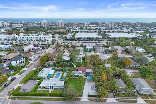 an aerial view of a house with a yard