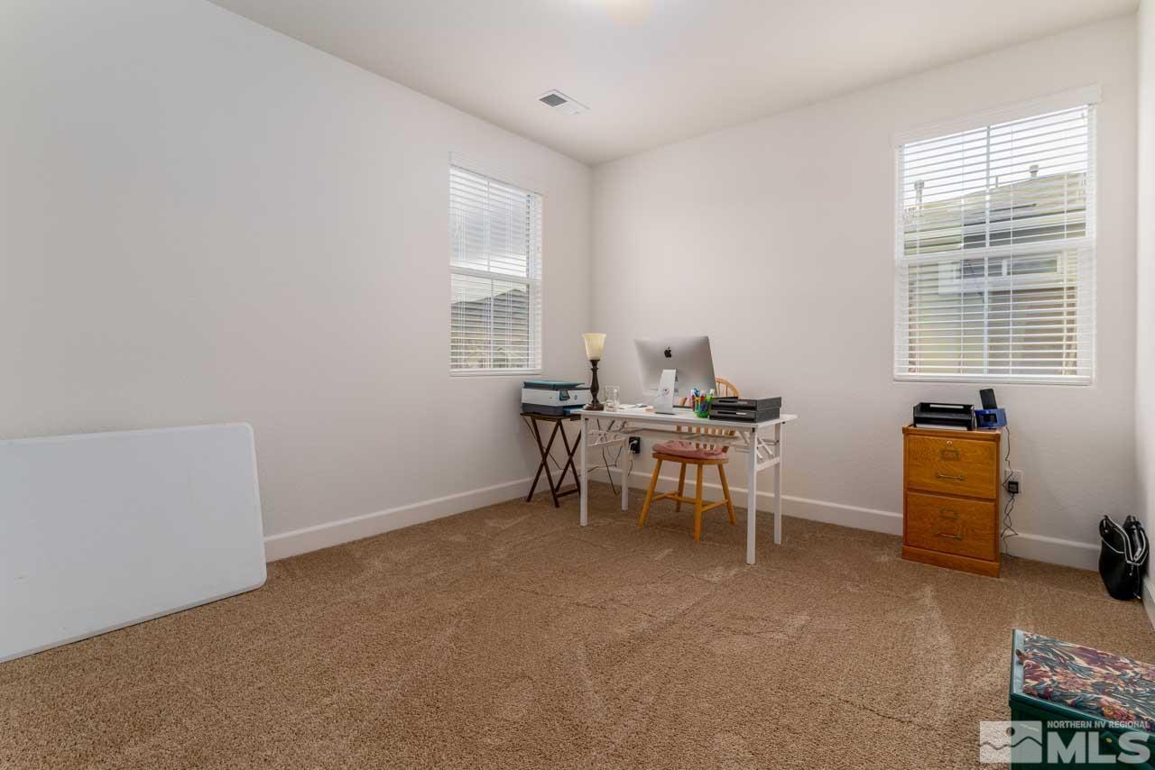 9341 Pond Court Reno, NV 89506 - Photo 18 of 30 a view of a workspace with furniture and a window