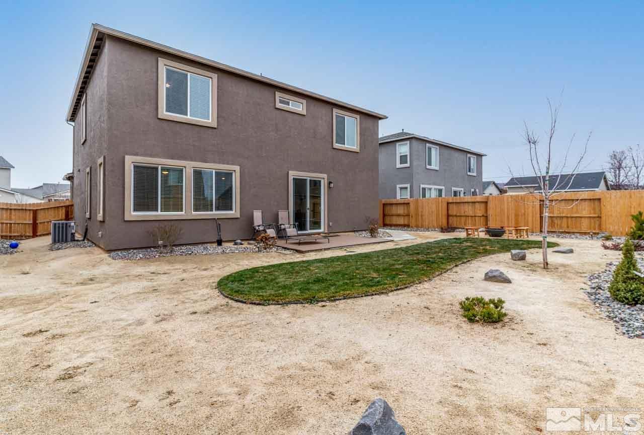 9341 Pond Court Reno, NV 89506 - Photo 24 of 30 a view of a house with backyard and sitting area