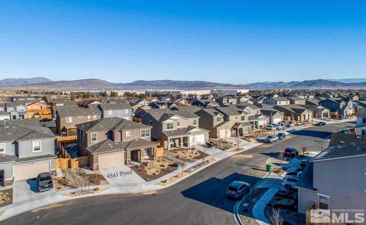 9341 Pond Court Reno, NV 89506 - Photo 28 of 30 an aerial view of residential houses with city view