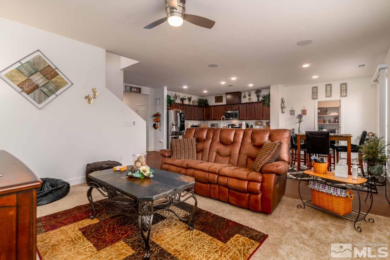 9341 Pond Court Reno, NV 89506 - Photo 5 of 30 a living room with furniture and a chandelier