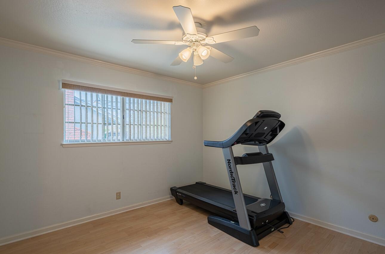 607 La Mesa Drive Salinas, CA 93901 - Photo 22 of 34 a room with gym equipment and windows