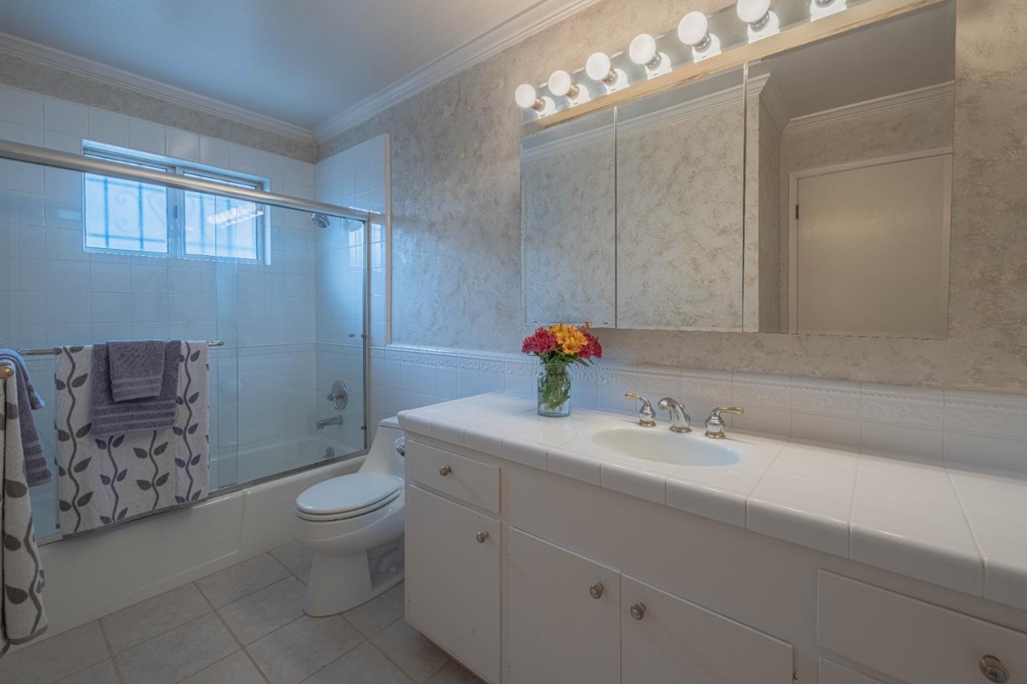 607 La Mesa Drive Salinas, CA 93901 - Photo 27 of 34 a bathroom with a sink a toilet and shower