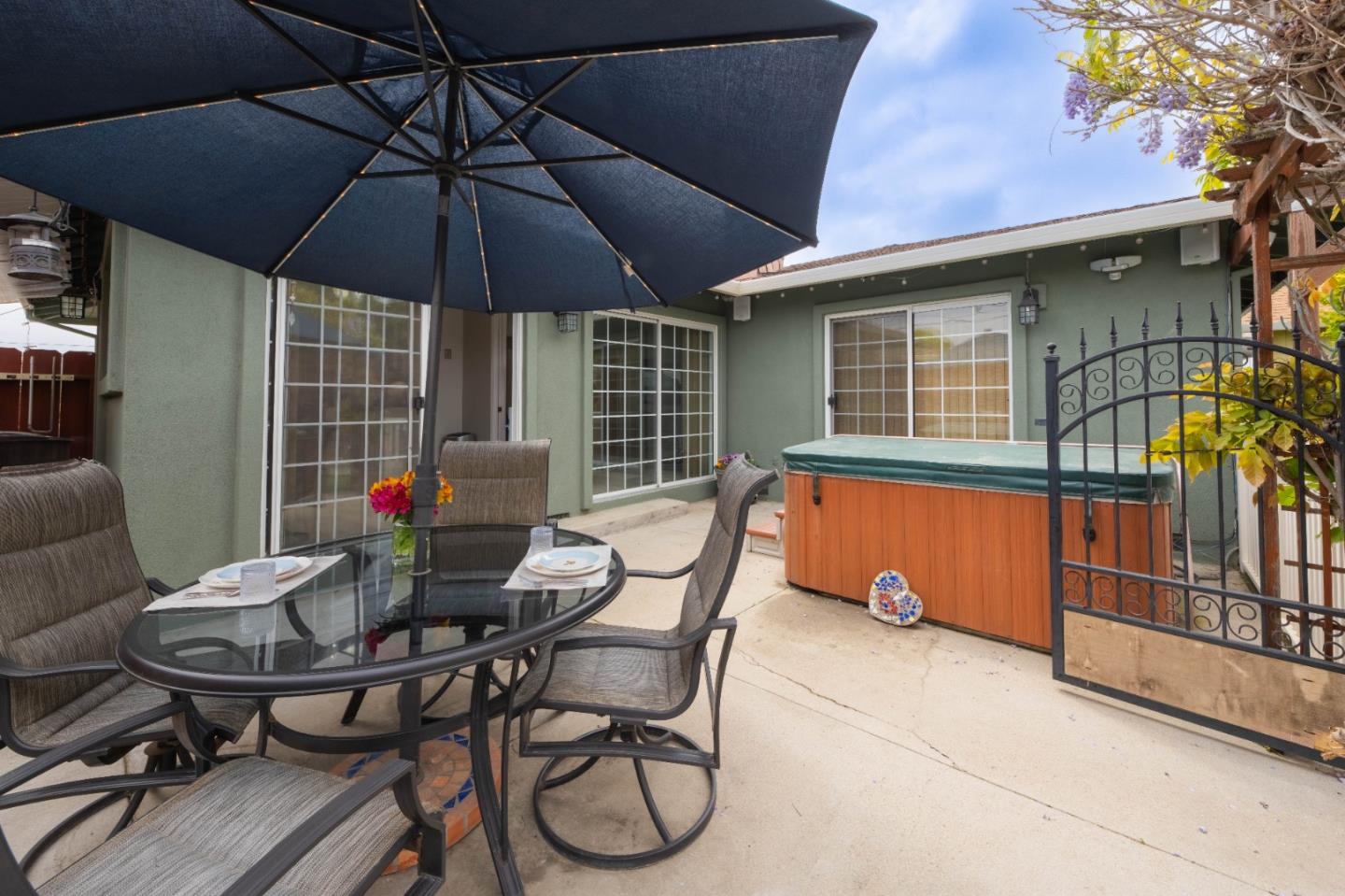 607 La Mesa Drive Salinas, CA 93901 - Photo 30 of 34 a patio table and chairs under an umbrella