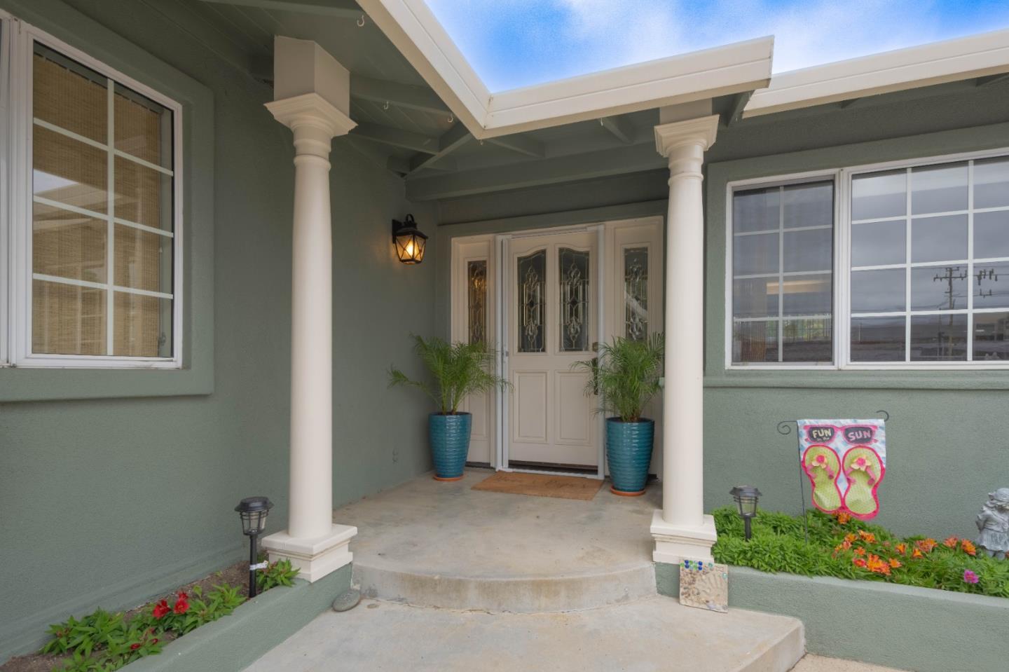 607 La Mesa Drive Salinas, CA 93901 - Photo 5 of 34 a front view of a house with a potted plant