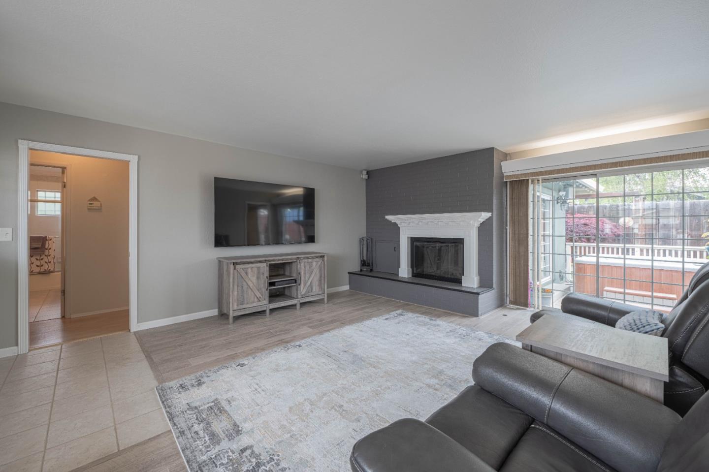 607 La Mesa Drive Salinas, CA 93901 - Photo 8 of 34 a living room with furniture and a flat screen tv