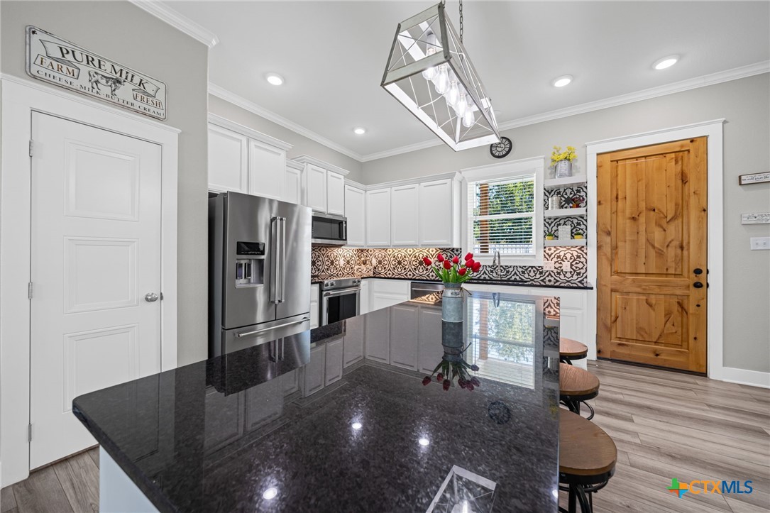 28099 Fm 2670 Killeen, TX 76549 - Photo 2 of 48 a kitchen with refrigerator cabinets and dining table
