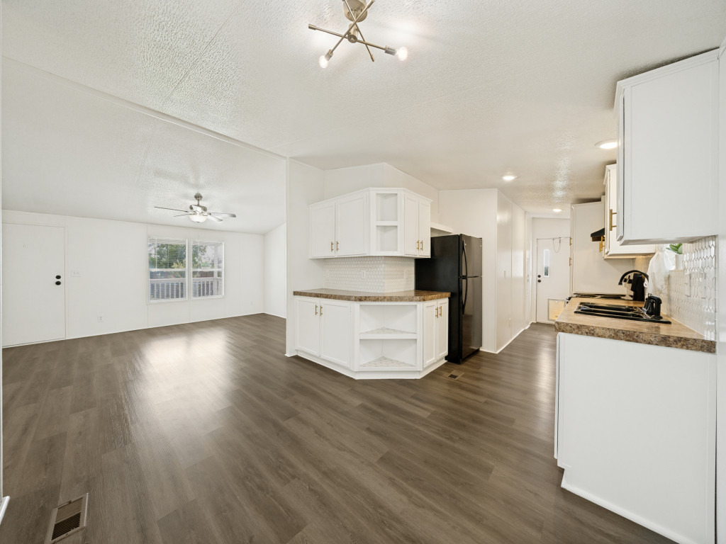 4654 Old Howard Road Temple, TX 76504 - Photo 25 of 25 An open concept floorplan seamlessly connects the kitchen and living areas, offering effortless movement and a bright, inviting atmosphere.