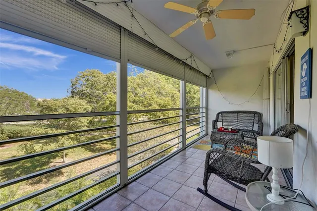 a view of two chairs in the balcony