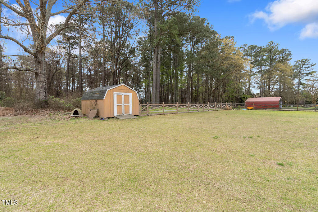 279 Zacks Mill Road Benson, NC 27504 - Photo 37 of 48 Storage Building & Dog Run