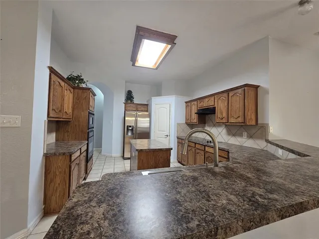 a room with furniture and a wooden floor