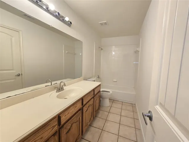 a bathroom with a sink a mirror and a shower