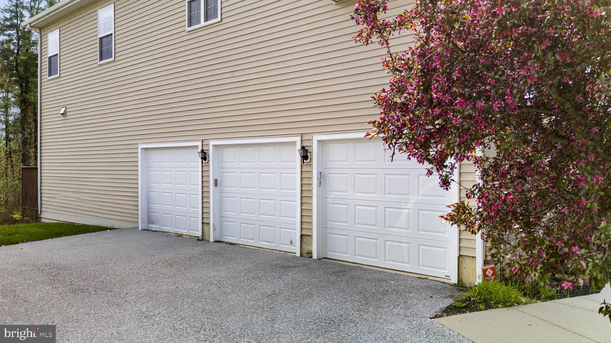1417 Stockton Road Coatesville, PA 19320 - Photo 33 of 39 Charming garage with blooming flowers.