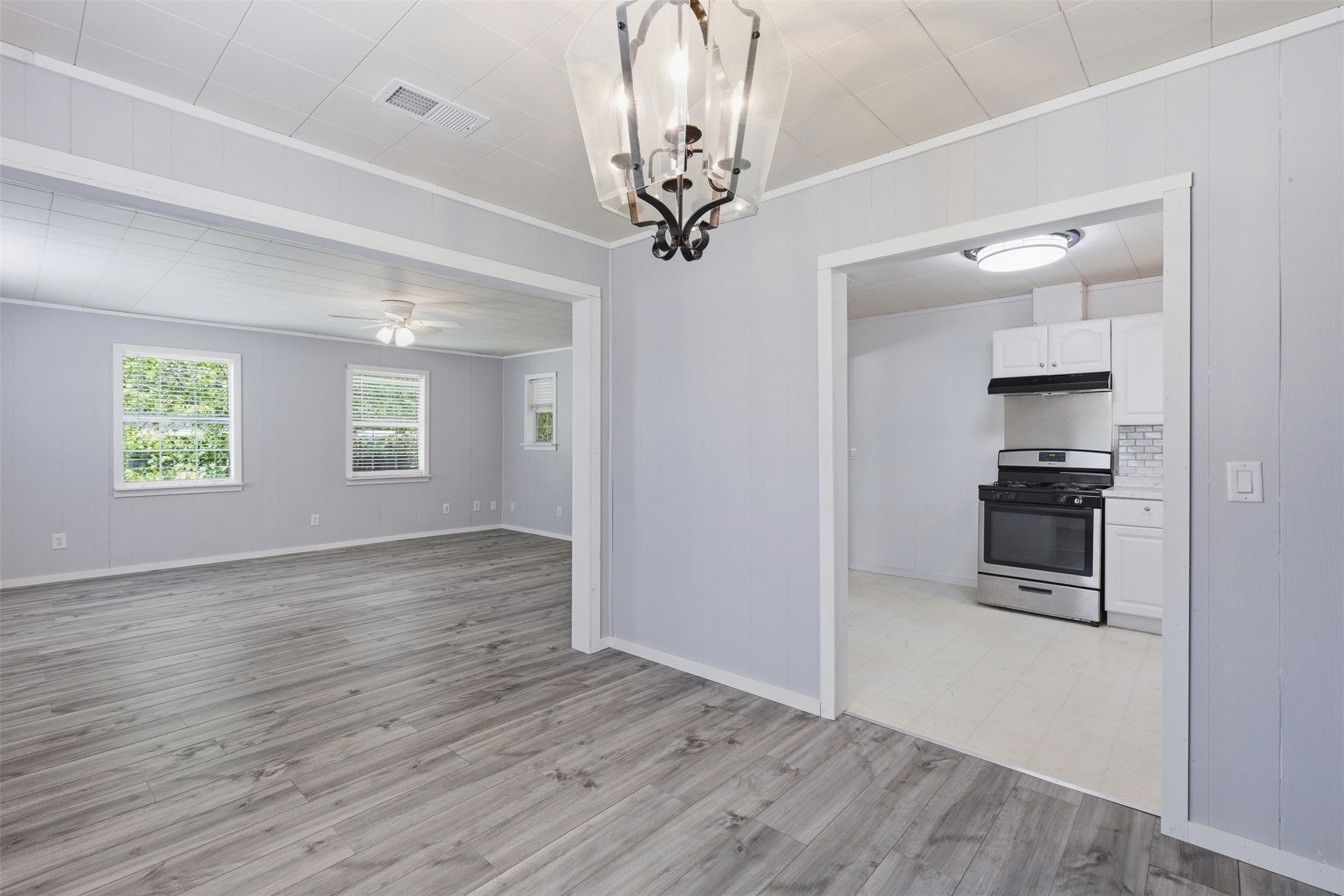 1310 Brazos Street Hempstead, TX 77445 - Photo 8 of 32 wooden floor in an empty room with a window