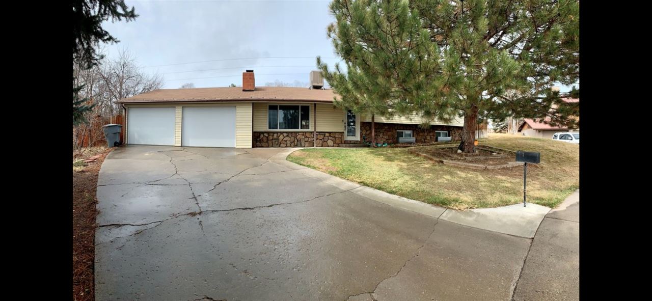 849 Cactus Court Rifle, CO 81650 - Photo 1 of 1 a view of a house with a yard and garage