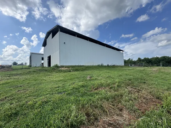 a backyard of a house with lots of green space and mountain view