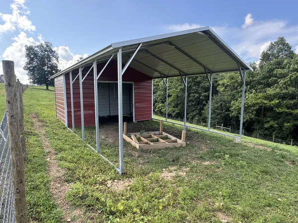 a view of a house with backyard and porch