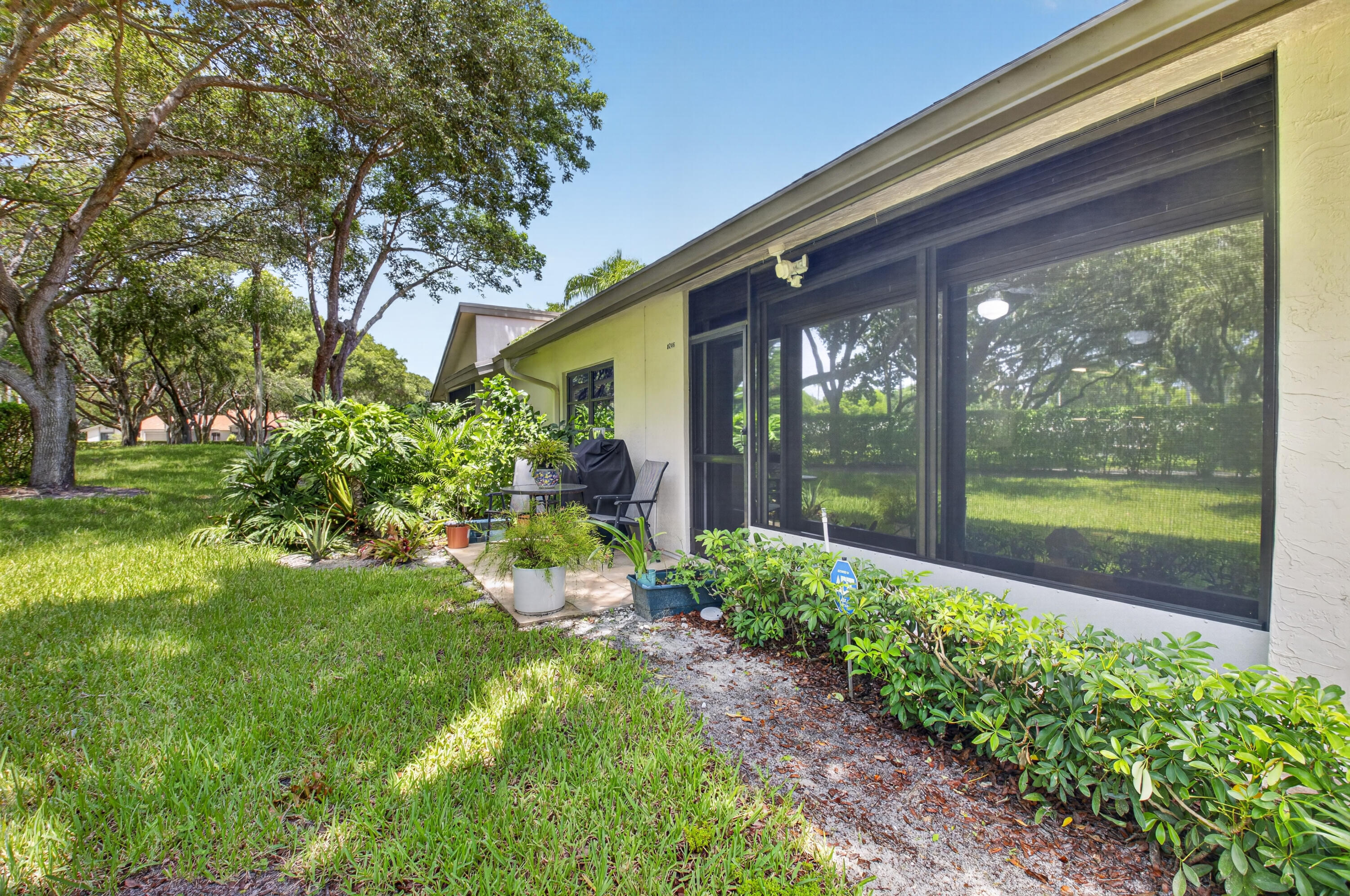 8246 Springview Terrace Boca Raton, FL 33496 - Photo 32 of 53 a view of a garden from a windows
