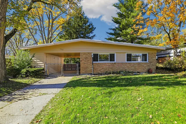 front view of a house with a yard