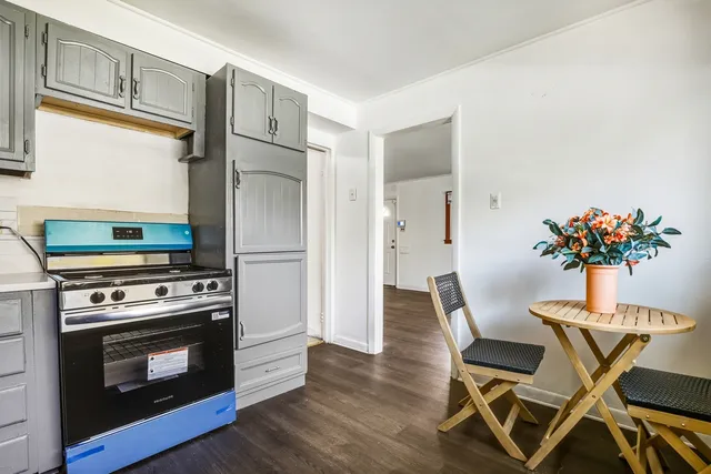 a kitchen with a stove and a refrigerator