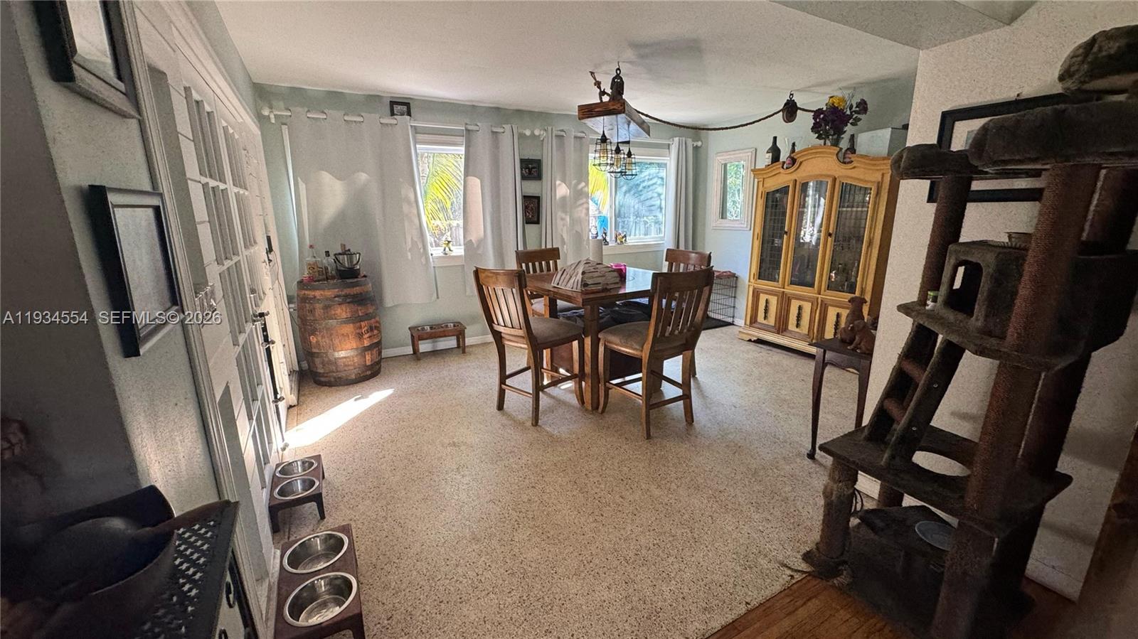 630 Northeast 165th Street Miami, FL 33162 - Photo 12 of 34 a view of a livingroom with furniture and a window