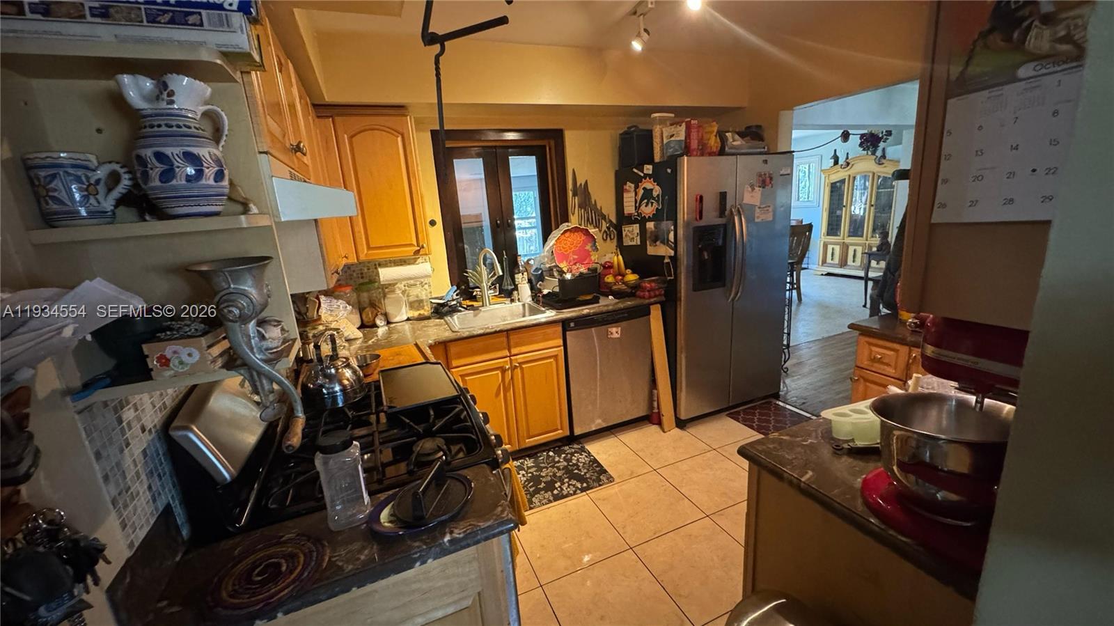 630 Northeast 165th Street Miami, FL 33162 - Photo 16 of 34 a view of a room with gym equipment