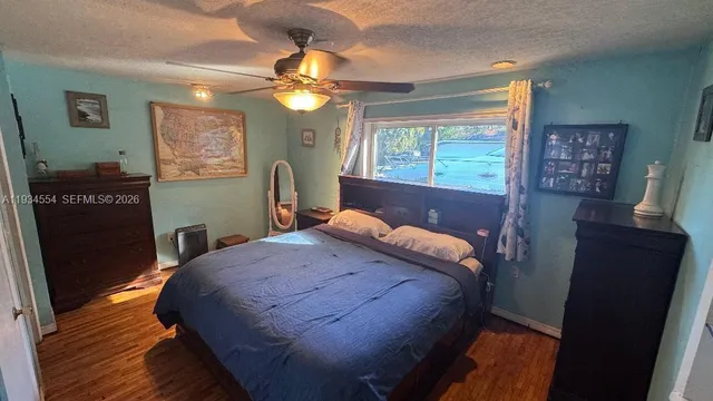 a view of a livingroom with wooden floor and window