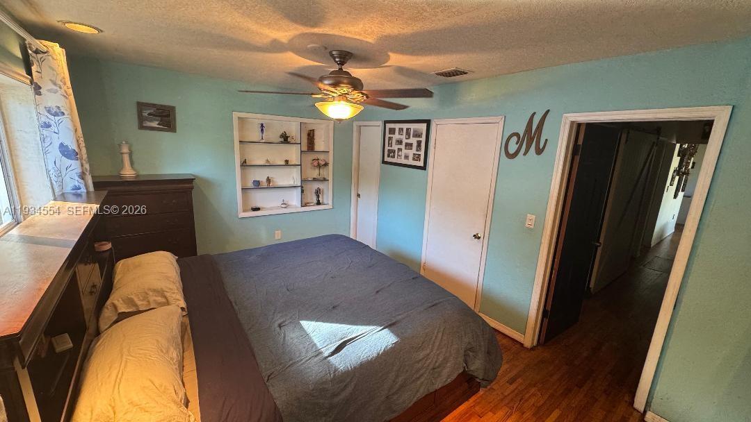 630 Northeast 165th Street Miami, FL 33162 - Photo 26 of 36 a view of a livingroom with wooden floor and window
