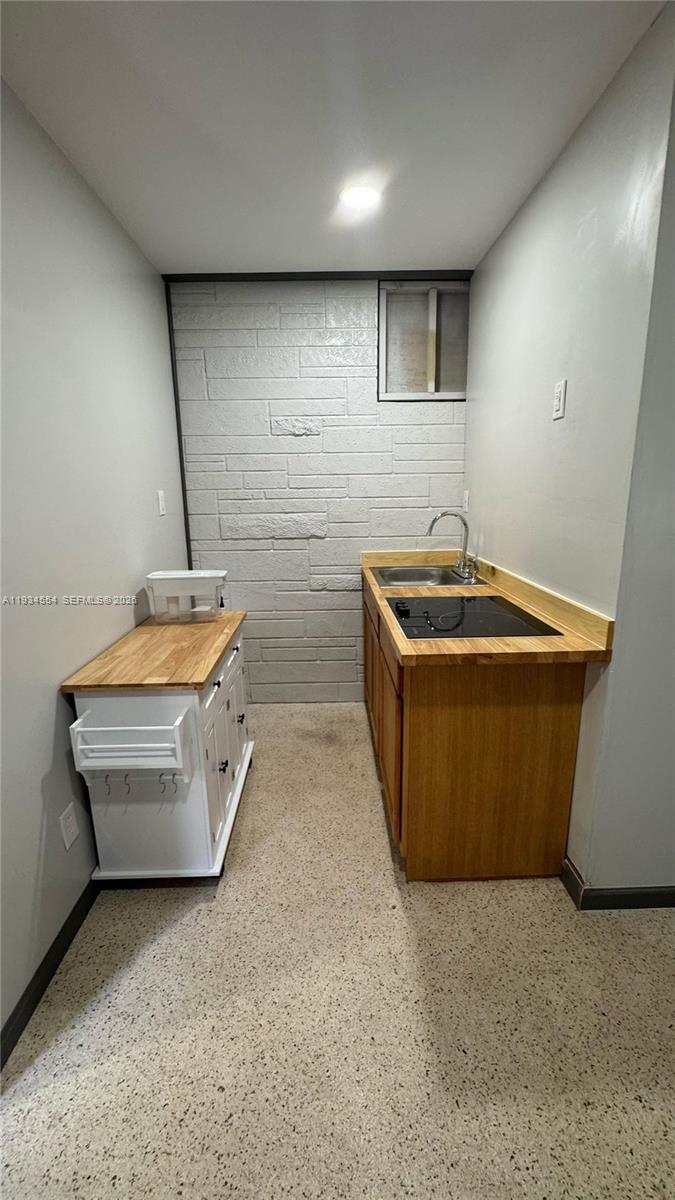 630 Northeast 165th Street Miami, FL 33162 - Photo 32 of 36 a room with wooden cabinets