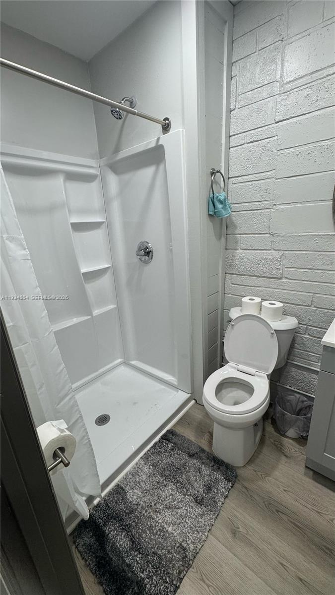630 Northeast 165th Street Miami, FL 33162 - Photo 34 of 34 a bathroom with a toilet and a shower