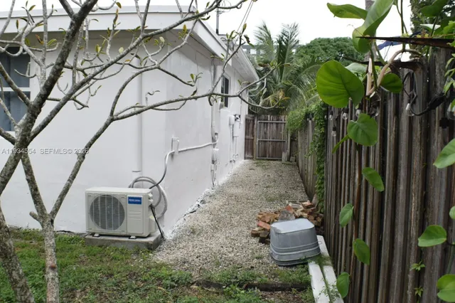 a view of a backyard with sitting area