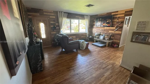 a living room with furniture fireplace and a flat screen tv