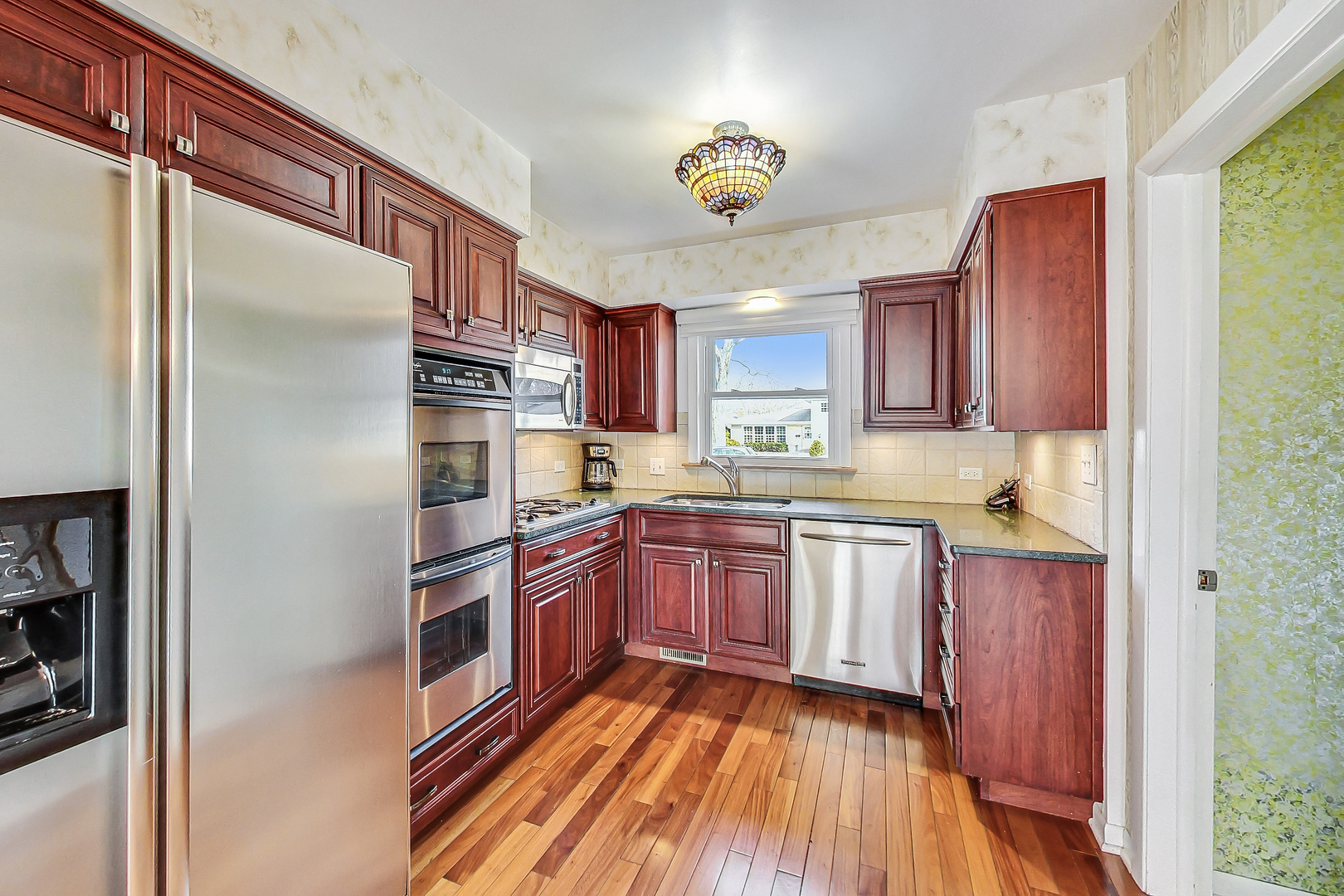 2101 Walnut Street Park Ridge, IL 60068 - Photo 11 of 37 a kitchen with stainless steel appliances granite countertop a refrigerator and a sink