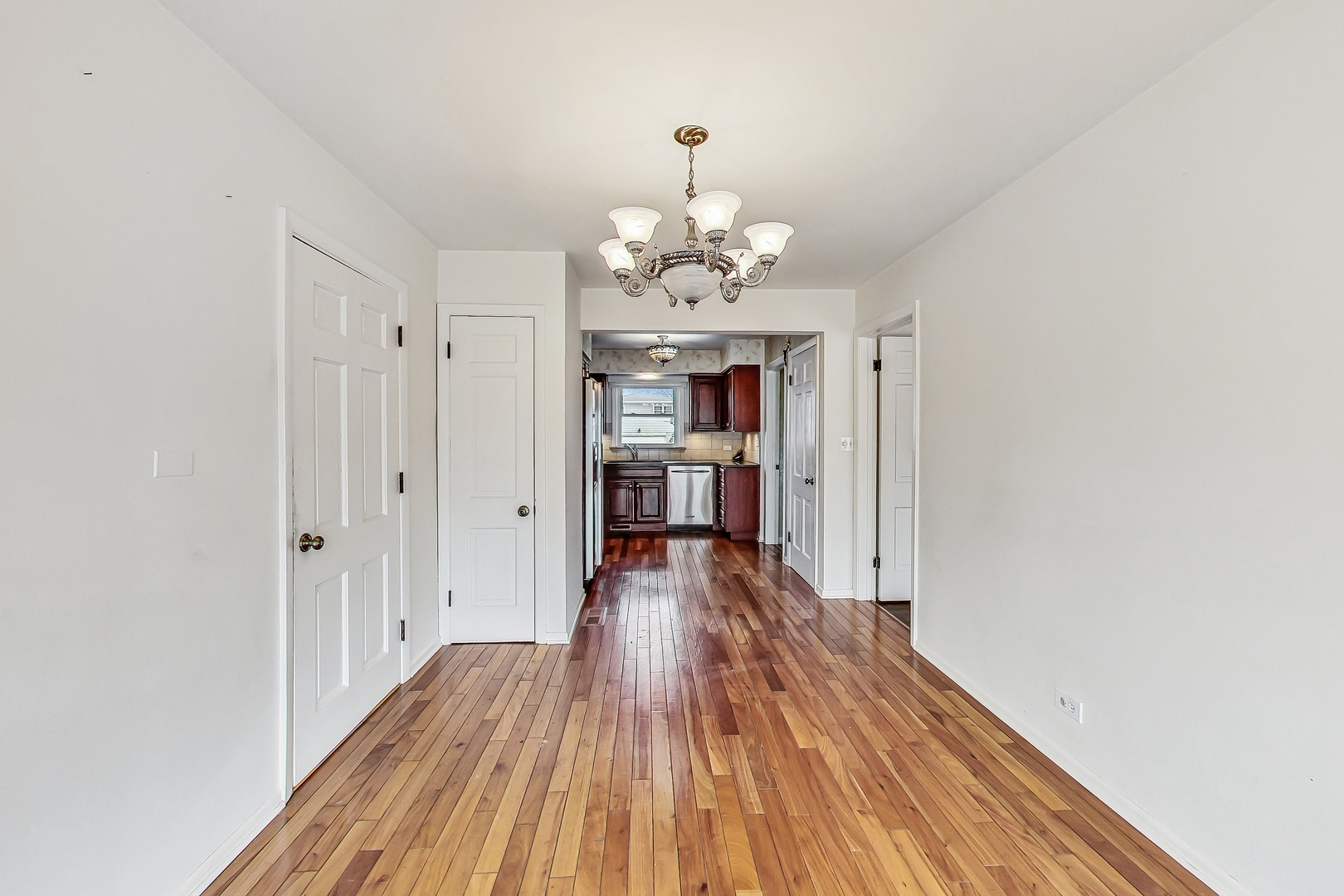 2101 Walnut Street Park Ridge, IL 60068 - Photo 13 of 37 a view of a room with wooden floor kitchen view and a window